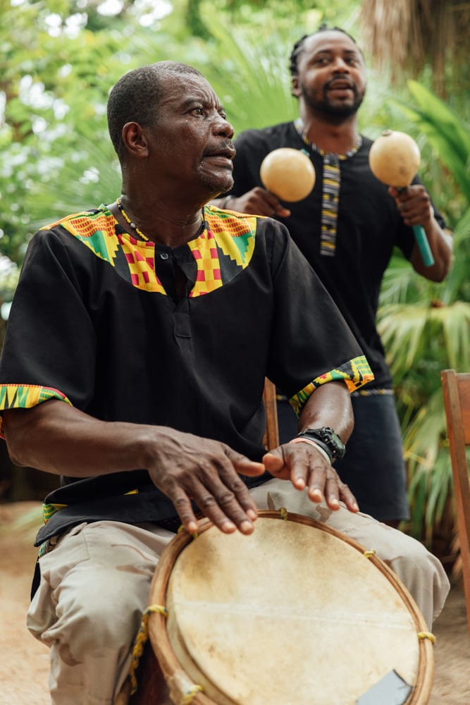 Garifuna musicians playing drums and sisira